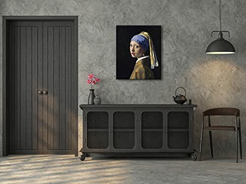 Modern room with painting, cabinet, and chair.