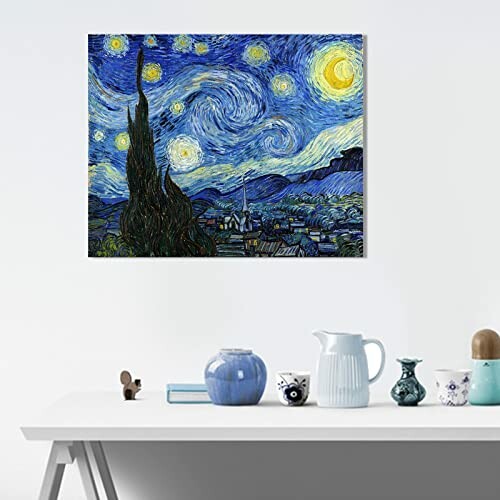 Room with Starry Night painting on the wall above a table with ceramics.